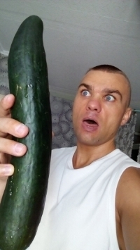 Man with huge cucumber